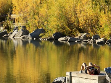Soaking up the sun beside the lagoon at Prince's Island was a great way to enjoy the fall colours on Sunday September 20, 2015.