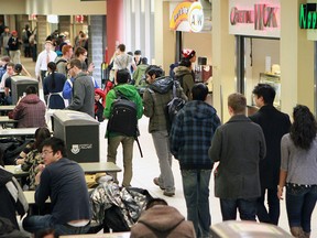 Students move through and hang out in the busy MacEwan Hall at the University of Calgary.