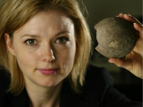 Darla Zelenitsky, the principal dinosaur researcher at the University of Calgary's department of geoscience, holds a dinosaur egg found in China.