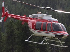 Calgary-08/30/00-The Bell 407 helicopter used in the rescue lifts off from the Lake Louise Ranger Station Wednesday afternoon. The helicopter is owned by Alpine Helicopters and was under contract to the NATIONAL Park. Photo by Grant Black/Calgary Herald (For City story by Emma Poole) SEARCH & RESCUE WORK,  HIKING, BANFF, HELECOPTERS, GENERIC**Taken from the Calgary Merlin Archive**