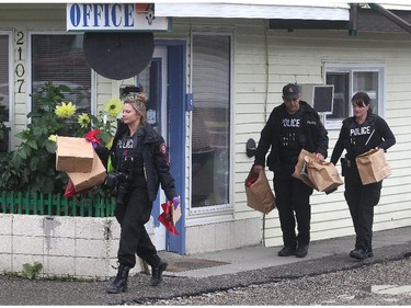 Calgary Police remove potential evidence from the Banff Trail Motel on 16th Avenue NW while investigating a suspicious death Monday  afternoon September 14, 2015.
