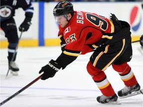 Calgary Flames' Sam Bennett (93) gets held up by Winnipeg Jets' Morgan Klimchuk during third period NHL rookie action in Penticton, B.C. on Friday September 11, 2015.