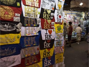 Buy a T-shirt, a watch or get your fortune read at the lively Temple Street Market in Kowloon, Hong Kong.