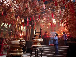 Temples in Hong Kong, like the Man Mo Temple pictured here, are a refuge for many from the city of seven-plus-million people.