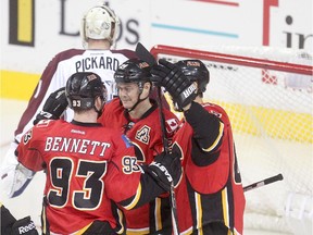 Calgary Flames veteran Jiri Hudler, middle, celebrates his second goal of the game on the Colorado Avalanche with teammates during pre-season action at the Scotiabank Saddledome on Tuesday night.