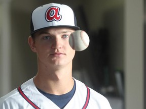 Calgary pitcher Mike Soroka wears his Atlanta Braves colours at home Tuesday before returning to the U.S. where he is in the team's minor league system.