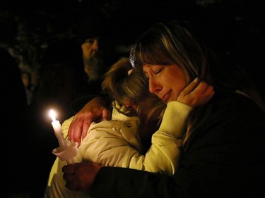 Family and friends of missing two-year-old Hailey Dunbar-Blanchette reacted at a candlelight vigil after being told the amber alert had been officially cancelled after human remains had been found on September 15, 2015. A member of the RCMP Victim Services unit was the person to inform the crowd.