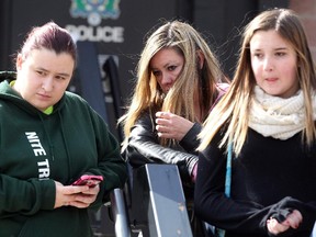 Family and friends of Terry Blanchette, from left, friend Becca Harrington, sister Amanda Blanchette and niece Kiana Blanchette, speak outside the RCMP detachment in Blairmore on September 15, 2015.