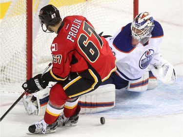 Edmonton Oilers goalie Anders Nilsson stopped a penalty shot by Calgary Flames right winger Michael Frolik during the second period of a split squad preseason NHL game at the Scotiabank Saddledome on September 21, 2015.