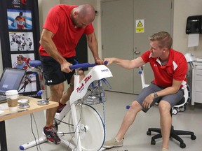 Calgary Flames captain Mark Giordano performs his bike fitness test at WinSport on Thursday. On ice sessions for the team begin on Friday.