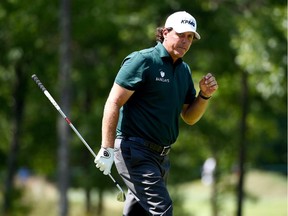 Phil Mickelson reacts after his second shot on the 15th hole during the final round of the Deutsche Bank Championship at TPC Boston on September 7, 2015 in Norton, Massachusetts.