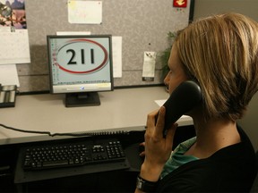 Jerilyn Dressler pictured taking a call at the Distress Centre in Calgary on July 13, 2009.