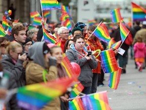 Almost everyone was waving rainbow flags on ninth ave. helping to celebrate 25 years of Pride Parades in Calgary on September 6, 2015.