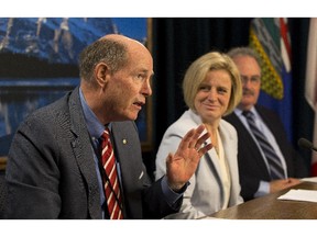 David Dodge, former governor of the Bank of Canada, with Premier Rachel Notley and Brian Mason, Minister of Infrastructure, on June 19, 2015, in Edmonton.