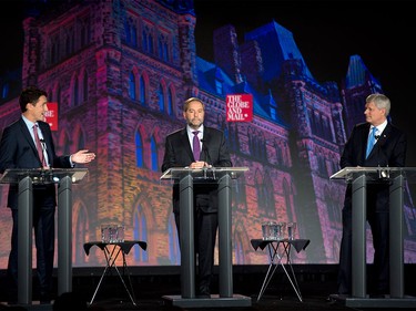 Liberal Leader Justin Trudeau, left, NDP Leader Tom Mulcair and Conservative Leader Stephen Harper, right, take part in the Globe and Mail hosted leaders' debate Thursday, Sept. 17, 2015 in Calgary.