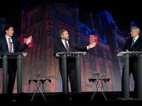 Liberal Leader Justin Trudeau, left, NDP Leader Tom Mulcair and Conservative Leader Stephen Harper, right, take part in the Globe and Mail leaders' debate Thursday, Sept. 17, 2015  in Calgary.