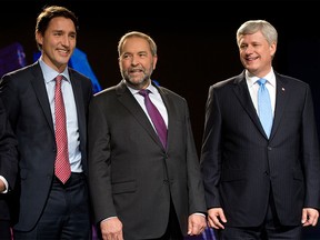 Liberal Leader Justin Trudeau, left, NDP Leader Tom Mulcair and Conservative Leader Stephen Harper, right, pose for photos before the Globe and Mail-hosted leaders debate Thursday, Sept. 17, 2015  in Calgary.