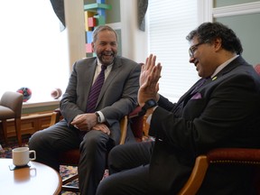 NDP Leader Tom Mulcair meets with Calgary Mayor Naheed Nenshi at City Hall in Calgary on Sept. 16, 2015.