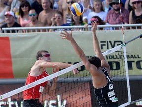 Calgary's Ben Saxton spikes the ball against Germany's Jonathan Erdman during the bronze medal match of the Olsztyn Grand Slam on Aug. 30. Saxton and Team Canada partner Chaim Schalk won to claim their second FIVB World Tour medal of 2015. This week they're gunning for No. 3 at the world finals in Fort Lauderdale, Fla.