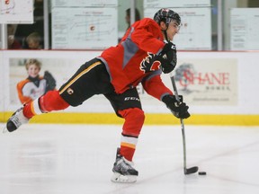 Kenny Agostino takes a shot on net during Calgary Flames practice on Sunday.