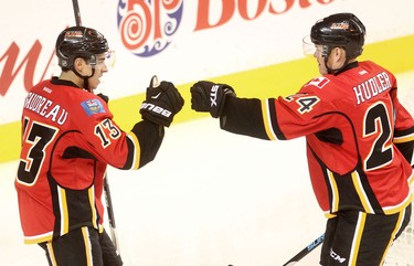 Calgary Flames  Johnny Gaudreau, left, celebrates Jiri Hudler's goal against the Colorado Avalanche during pre-season action at the Scotiabank Saddledome.