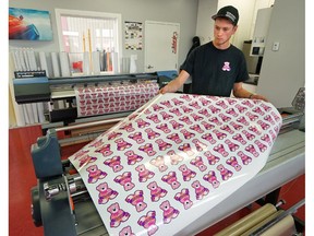Wayne Van Driesten, from MAC Auto Glass & Graphics in Fort Macleod, AB, prints another batch of "Justice for Hailey" stickers Friday.   The company owners were so touched by the recent tragic murder of 2-year-old Hailey Dunbar-Blanchette they wanted to do something meaningful.  The stickers are available at a variety of Fort Macleod businesses and are being mailed out across the country.
