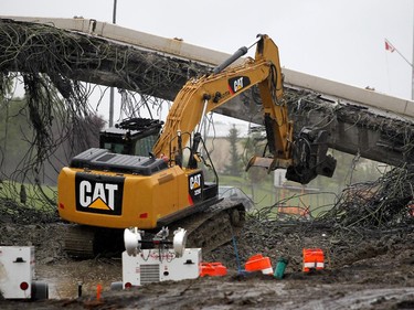 Construction crews worked to dismantle the Flanders Avenue bridge over Crowchild Trail on September 5, 2015 to make way for a new overpass.