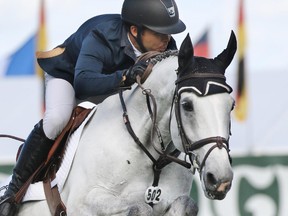 American rider Kent Farrington on Uceko finished first in the jump off for the Akita Drilling Cup at the Spruce Meadows Masters on Wednesday.