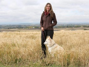 Shelley Alexander, an associate professor in the geography department at the University of Calgary, is starting a project on coyotes just outside the city limits to the Eastern front of the Rockies. She is pictured near Tuscany in Calgary with her dog Mischa.