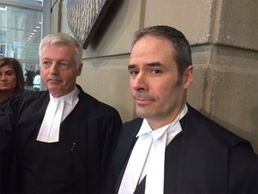 Calgary  Crown prosecutor Lloyd Robertson (right), with Crown Joe Mercier (left) appointed as judge.