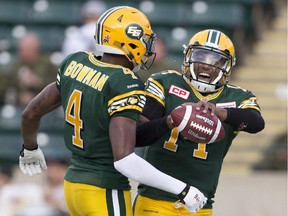 Edmonton Eskimos quarterback James Franklin, right, and Adarius Bowman celebrate a touchdown against the Toronto Argonauts during their Aug. 28 meeting.