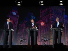 Liberal Leader Justin Trudeau, from left, NDP Leader Tom Mulcair and Conservative Leader Stephen Harper take part in a debate Thursday.