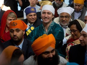 Liberal Leader Justin Trudeau smiles while attending a ceremony at the Khalsa Diwan Society Sikh Temple before the Vaisakhi parade in Vancouver last year.