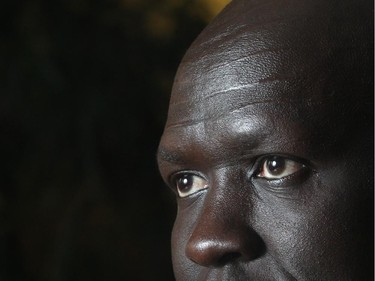 Former Lost Boy of Sudan, now a Calgary Police Cadet Program graduate, Stephen Deng, speaks with the Herald Thursday July 23, 2015 about his experiences and the challenges of fitting into Canadian society. On his forehead are the marks of gaar, a Sudanese transition to manhood.