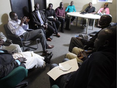 Community members  from the South Sudan discuss issues concerning to the local community at the Sudanese Outreach Centre that Stephen Deng founded in Forest Lawn Friday July 17, 2015. The centre fosters discussion on topics and concerns of the community as well as a acting as a social outlet.