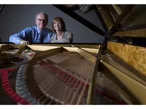 Michael and Nicole Lipnicki, owners of Lipnicki Fine Pianos, at the Faziolo piano chosen by the Honens winner in their shop in Calgary, on Sept. 16, 2015.