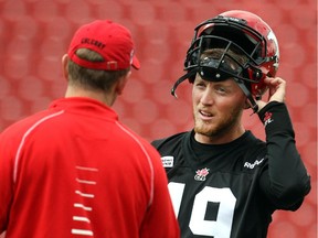 Calgary Stampeders quarterback Bo Levi Mitchell speaks with offensive co-ordinator Dave Dickenson during practice at McMahon Stadium earlier this week. The Stamps are aiming to bounce back in a big way this week after losing to Edmonton last Saturday.