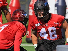 New Calgary Stampeders linebacker Cameron Ontko runs a drill during his first practice with the team on Wednesday.