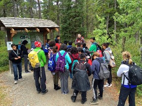 Students from Terry Fox School get directions before heading out on a hike up Yamnuska in Kananaskis Country.