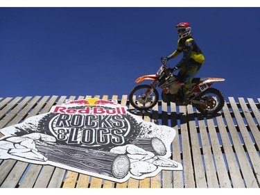 Clinton Boos, of the amateur category, rolls around the almost vertical wall turn as he competes in Canada's only Urban Endurocross Challenge, the Red Bull Rocks & Logs at Wild Rose MX park in Calgary, on September 12, 2015.