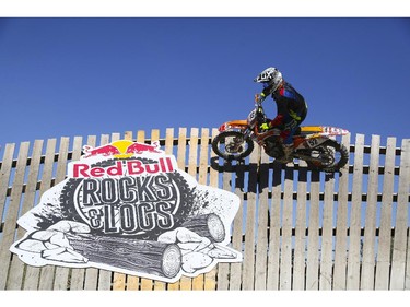 Tyler Murray, of the amateur category, rolls around the almost vertical wall turn as he competes in Canada's only Urban Endurocross Challenge, the Red Bull Rocks & Logs at Wild Rose MX park in Calgary, on September 12, 2015.