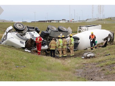 Investigators at the scene of a single vehicle cement truck rollover at Crowchild Trail and Stoney Trail early Tuesday morning in Calgary.