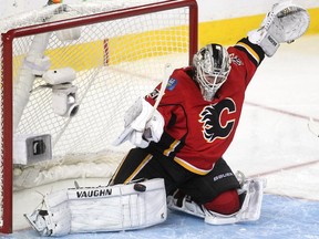 Calgary Flames goalie Karri Ramo makes a pad save against a the Anaheim Ducks during Game 4 of their playoff series last May. Ramo took over the club's No. 1 job in the playoffs but knows he will be in a battle with Jonas Hiller and Joni Ortio for starts again this season.