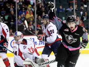 Layne Bensmiller of the Calgary Hitmen celebrates after scoring on Lethbridge Hurricanes goalie Stuart Skinner during a game last March. Bensmiller, who is the second cousin of GMC Rangeland Derby chuckwagon driver Kurt Bensmiller, has added 25 pounds of muscle to his frame over the off-season.