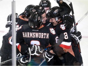 Hitmen Loch Morrison, 8, celebrates his goal, and the first goal of the game, with his linemates, in the second period as the Calgary Hitmen hosted the Kootenay Ice in their WHL home opener at the Saddledome.