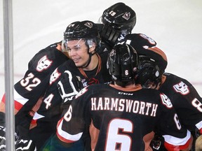 Carsen Twarynski, No. 24, of the Hitmen celebrates as he assisted on the team's only goal in a 1-0 win over the Kootenay Ice on Saturday night.
