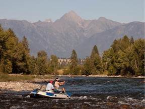 Guide Jeff Chlopan and Darren Wallace drifting towards Fisher Peak on the St. Mary River.