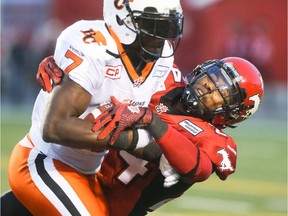 Calgary Stampeder Joe Burnett tackles B.C.'s Lavelle Hawkins during Friday's game. Burnett had a monster performance with three knockdowns, a pick and five tackles.