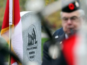 Pipers from the Scottish Tradition School of Piping play during the newly unveiled Field of Crosses Cenotaph along Memorial Drive in Calgary on September 26, 2015.