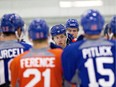 Edmonton Oilers' star Taylor Hall gathers with teammates during training camp in Leduc on Sunday.